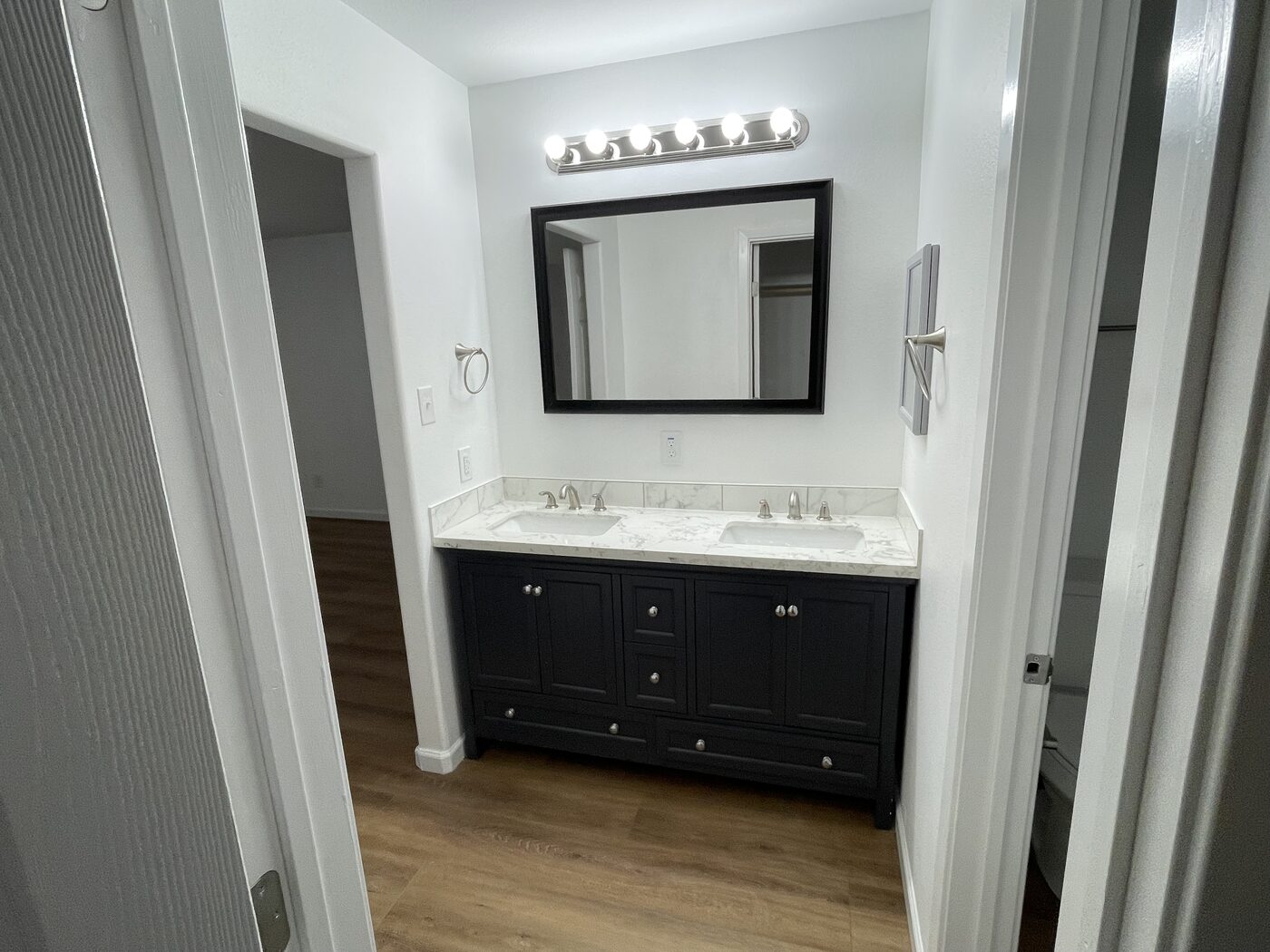 New bathroom vanity and mirror after fire rebuild in Coppell