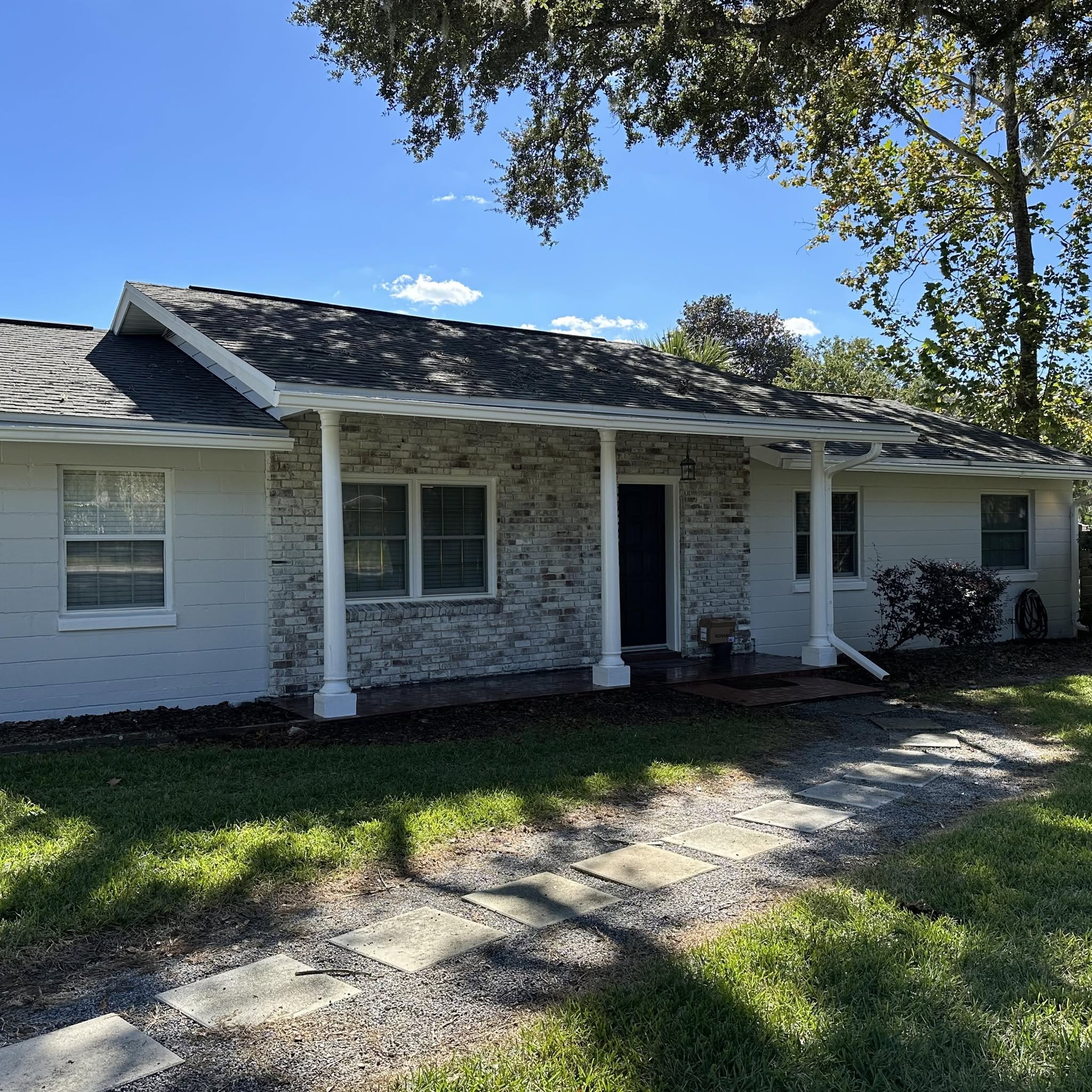 Painter working on a residential home exterior