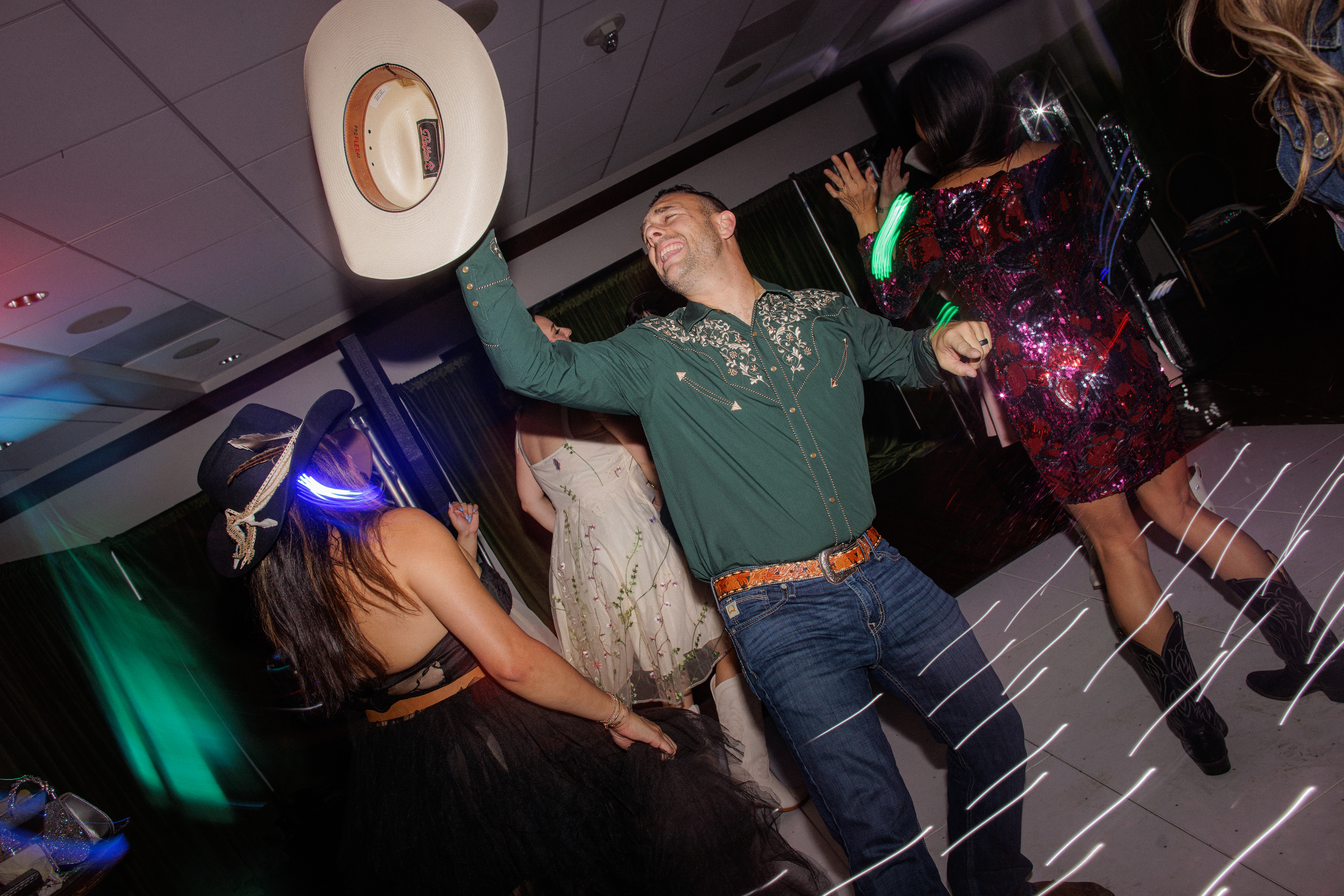 Corporate party with guests mingling and dancing