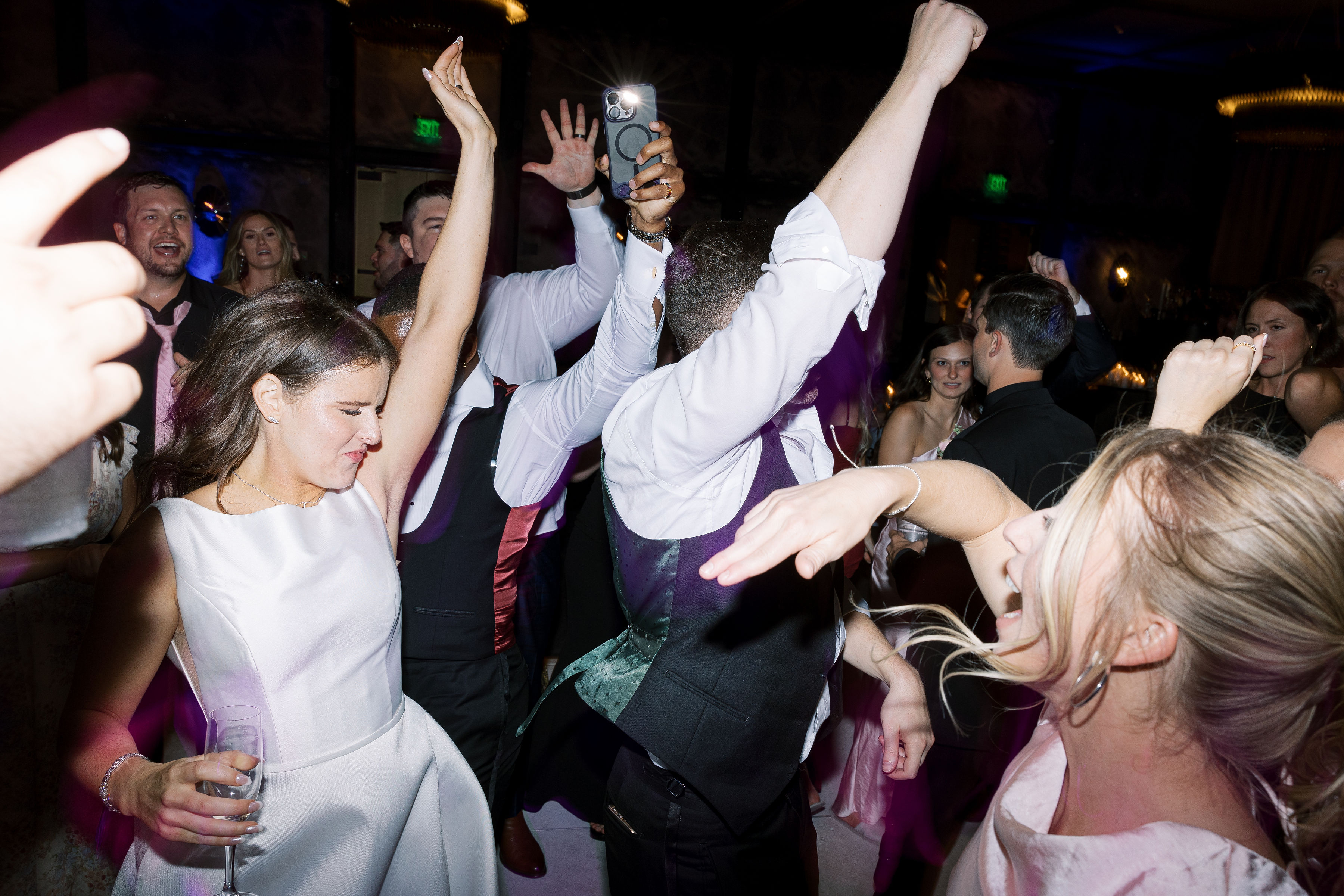 Couple dancing with guests celebrating