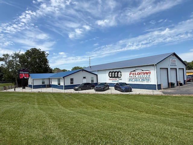 Feldman Auto lot in Greensburg, Indiana — used cars on the lot with the service bay behind them