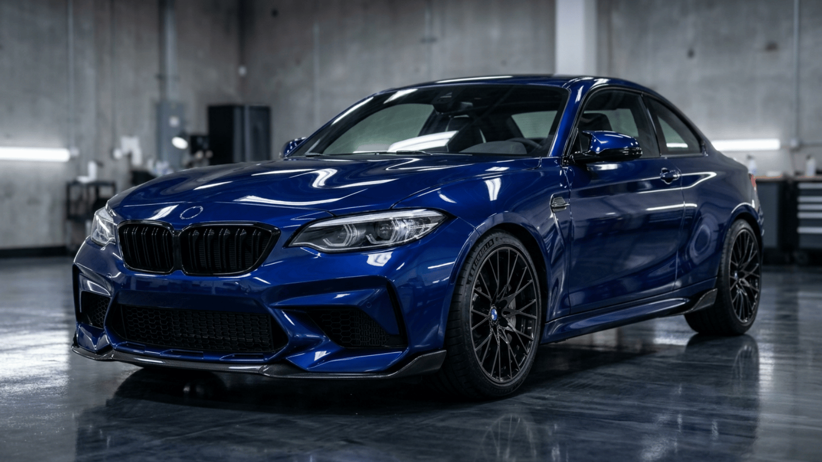 Gloss paint protection film on a dark blue sports car