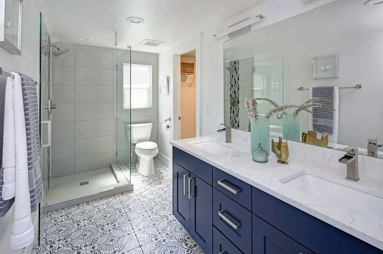 Blue and white bathroom remodel by Andler Building Co
