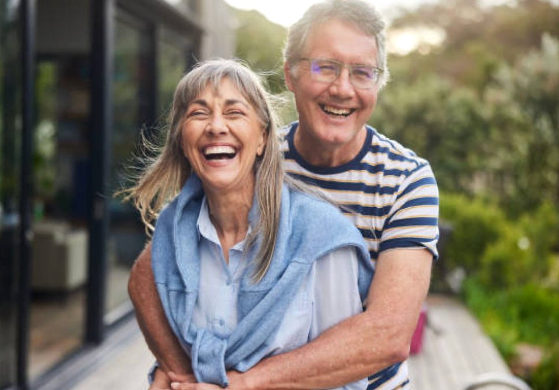 Happy middle-aged couple smiling outdoors