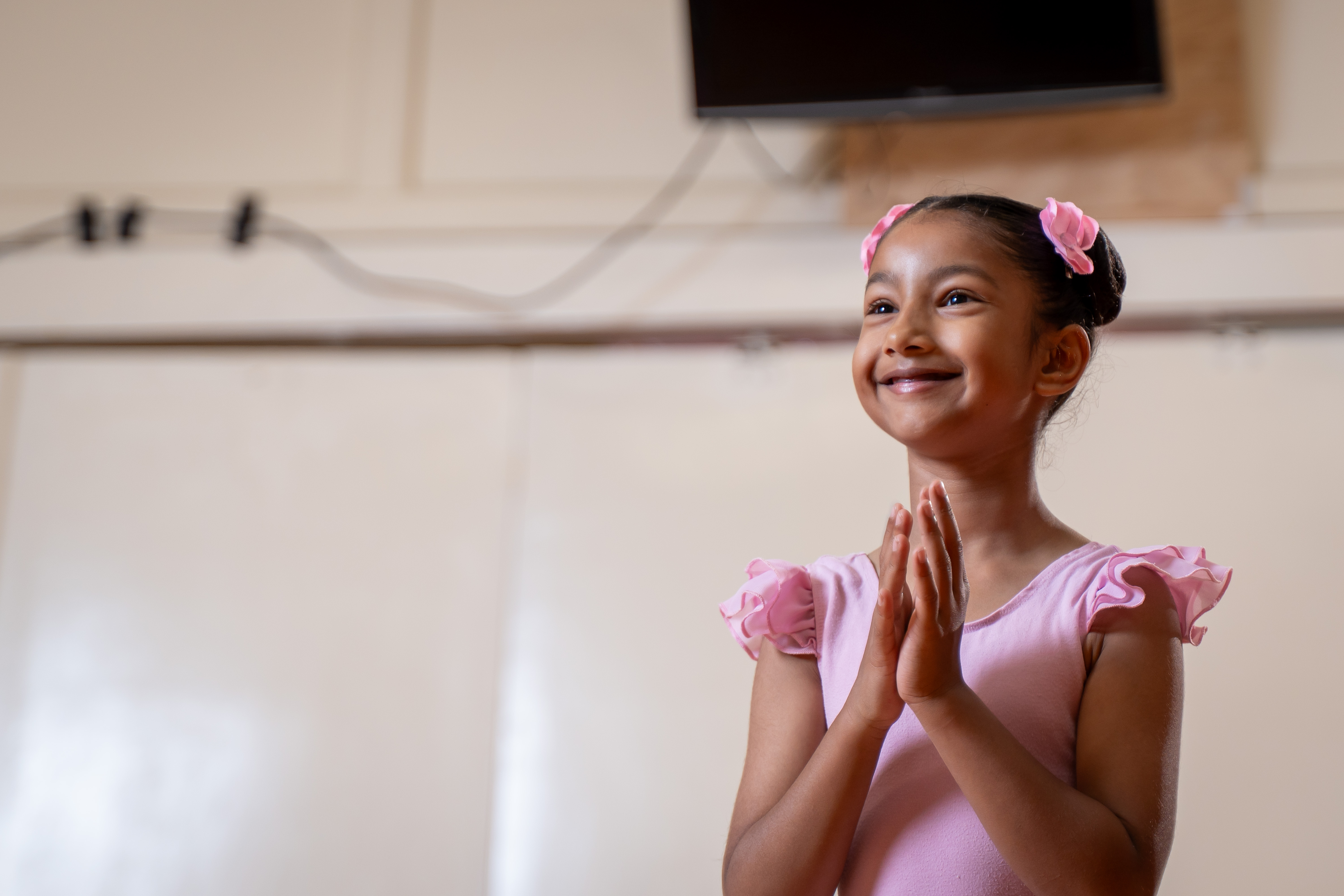 Young dancer smiling in ballet class