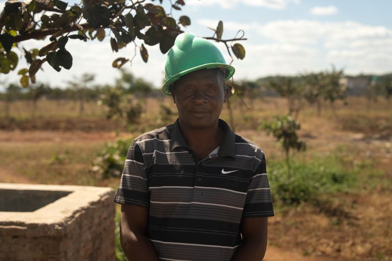 A man in a green hard hat