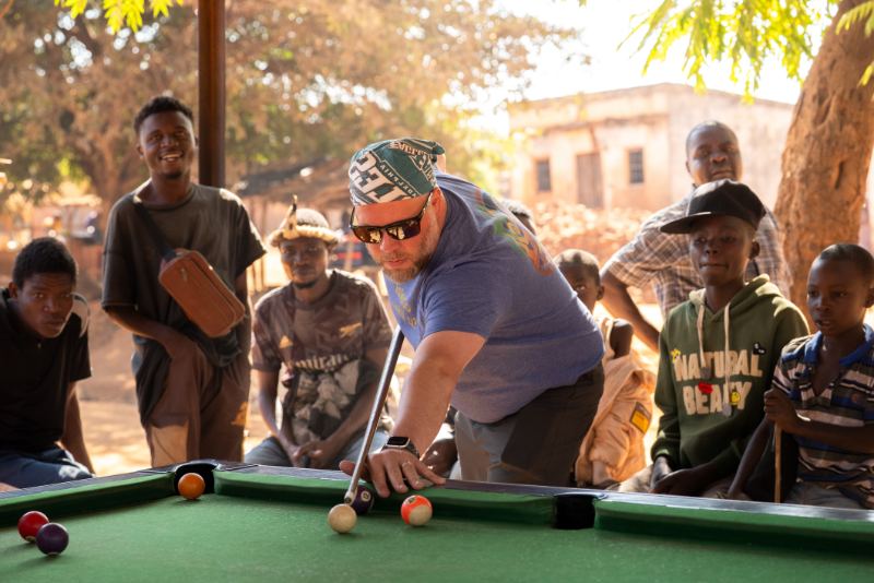 Playing pool with local kids in Malawi