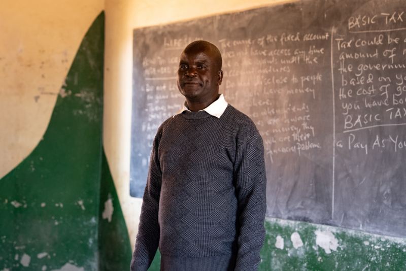 A teacher at the chalkboard