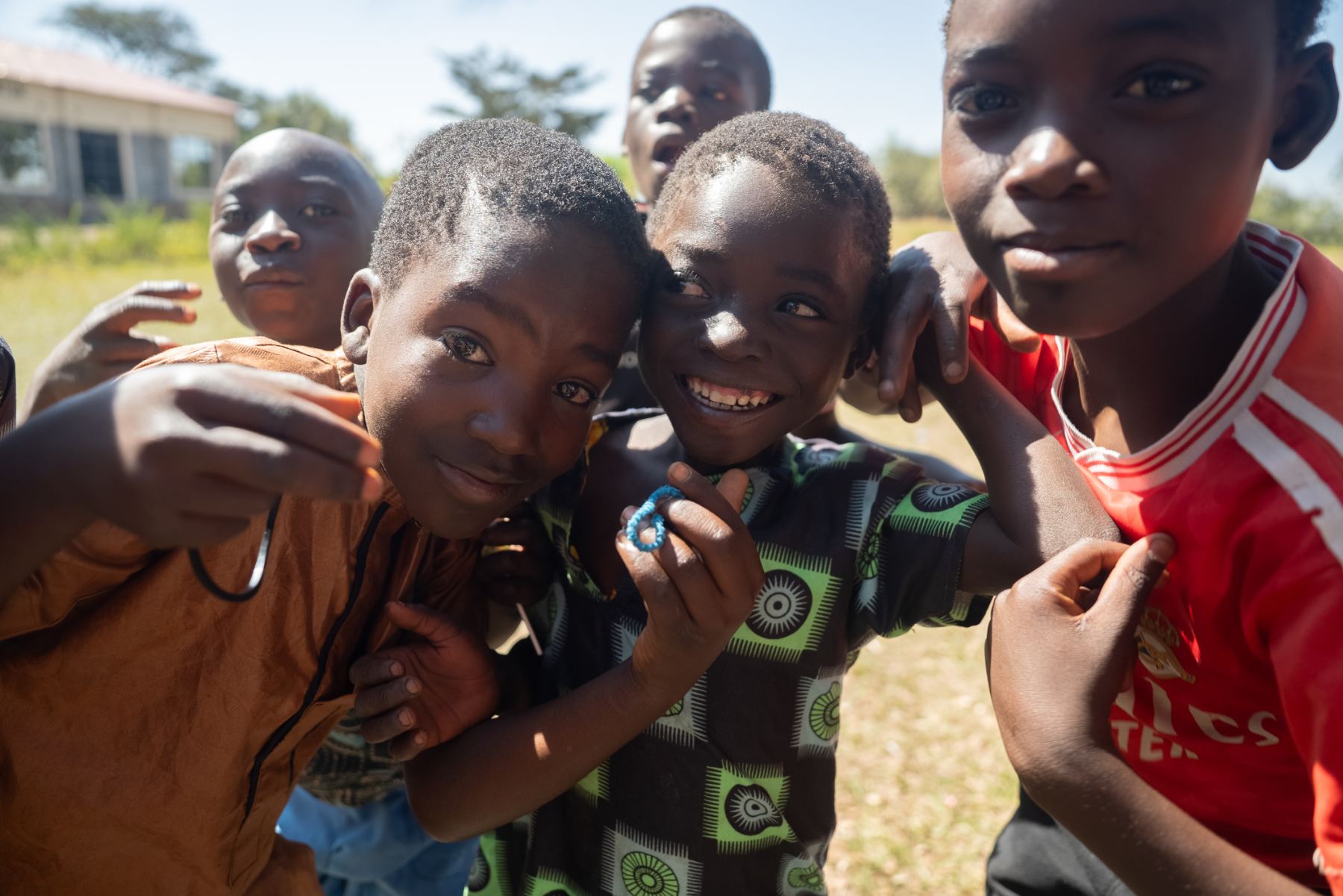 Kids in Malawi crowding the camera