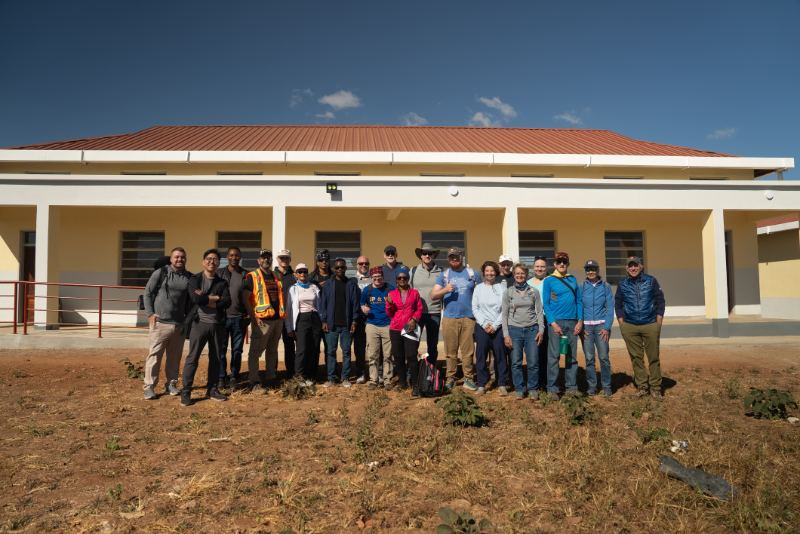 Church mission trip team in front of a school in Malawi