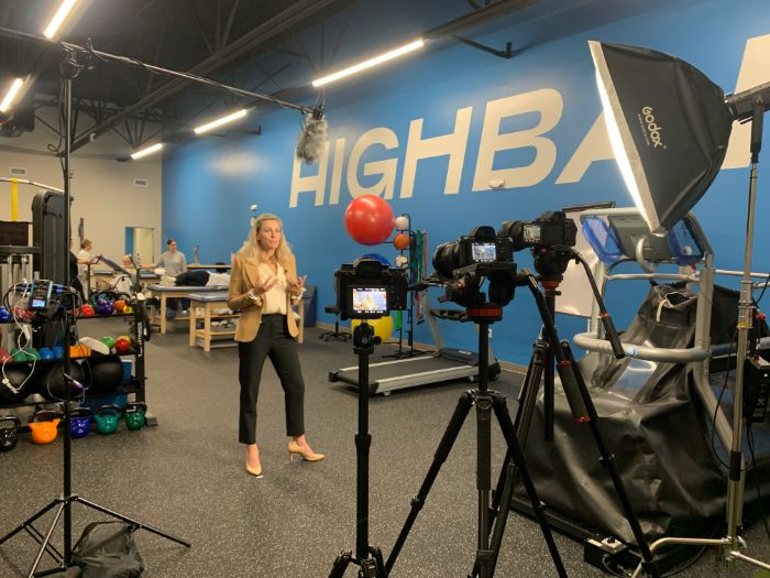 Multi-camera video shoot with studio lighting at a training facility