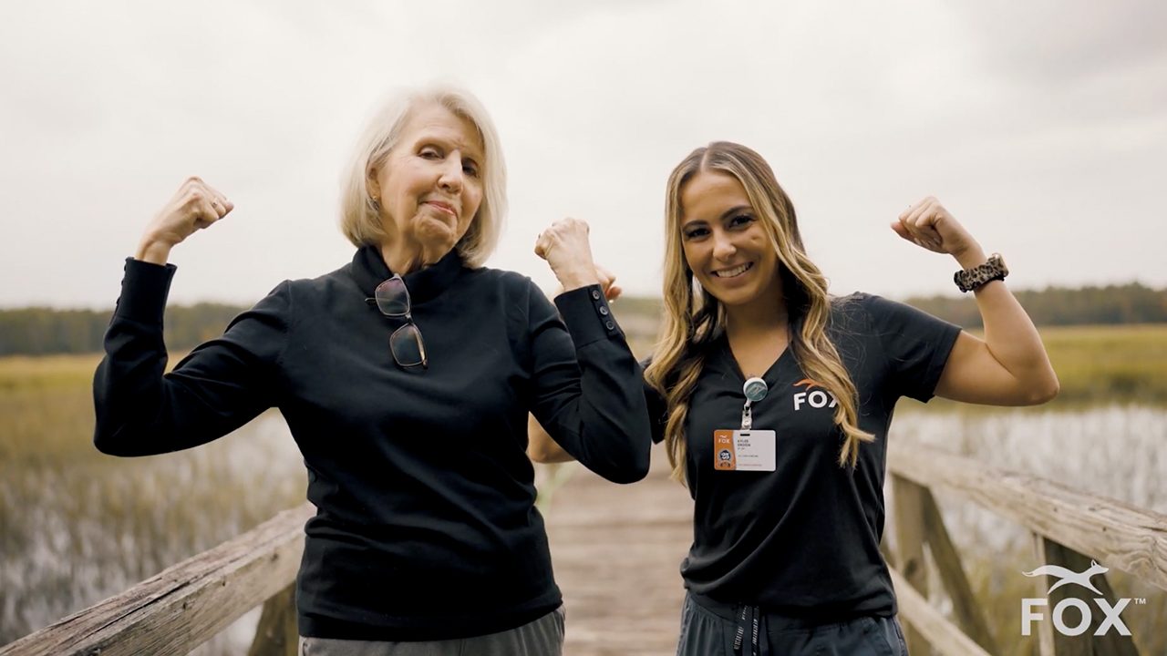 FOX Rehabilitation clinician and patient celebrating outdoors in a Cynder Media brand video