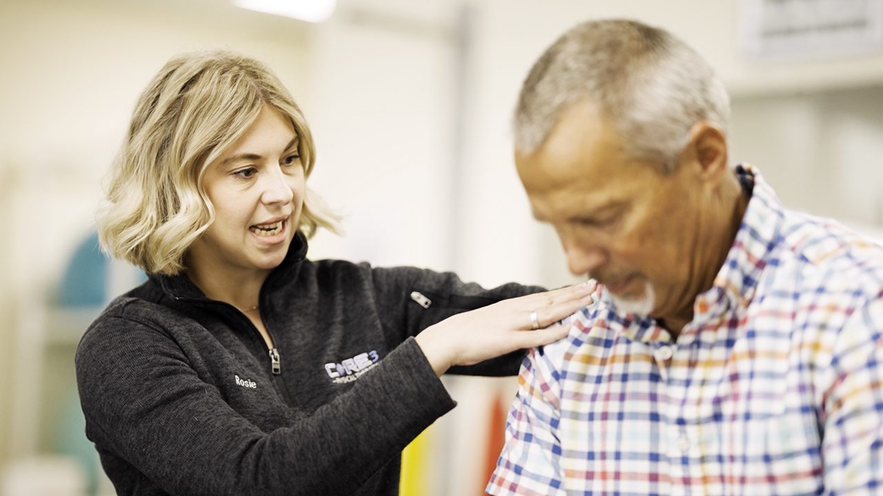 Physical therapist working with a patient in a Cynder Media video