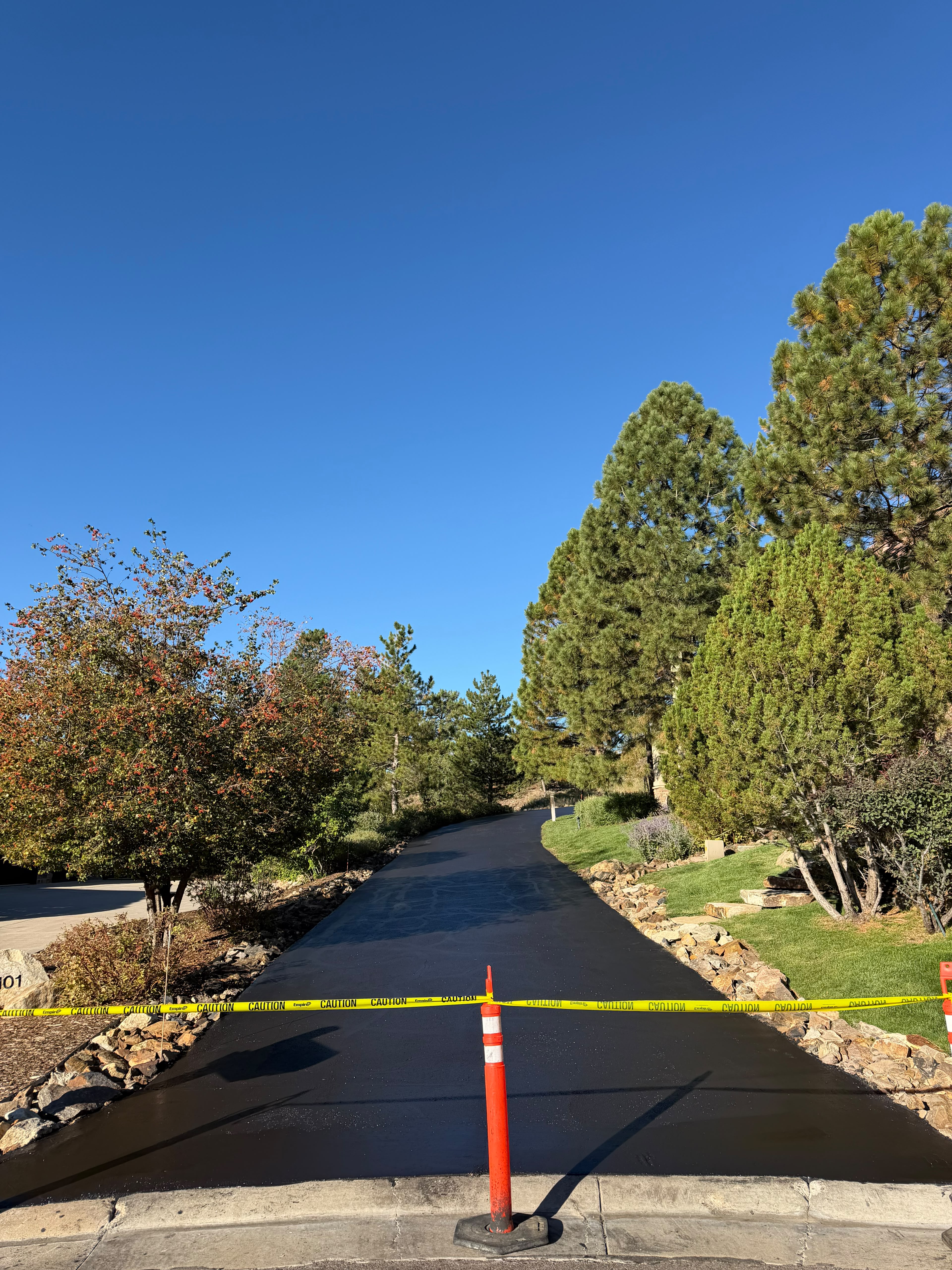 Residential driveway with a fresh black sealcoat