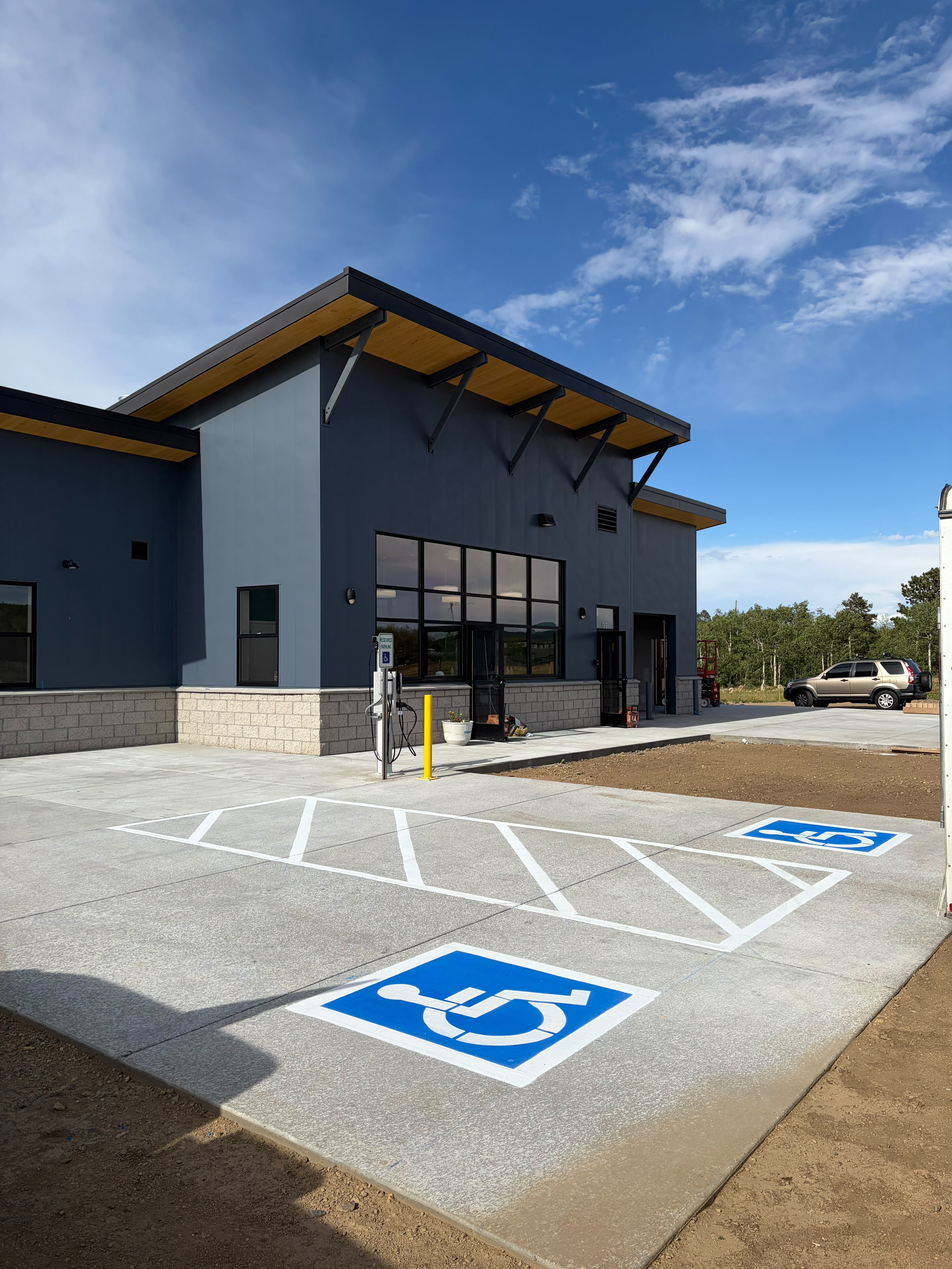 Concrete pad with a brand new striping layout and handicap stalls