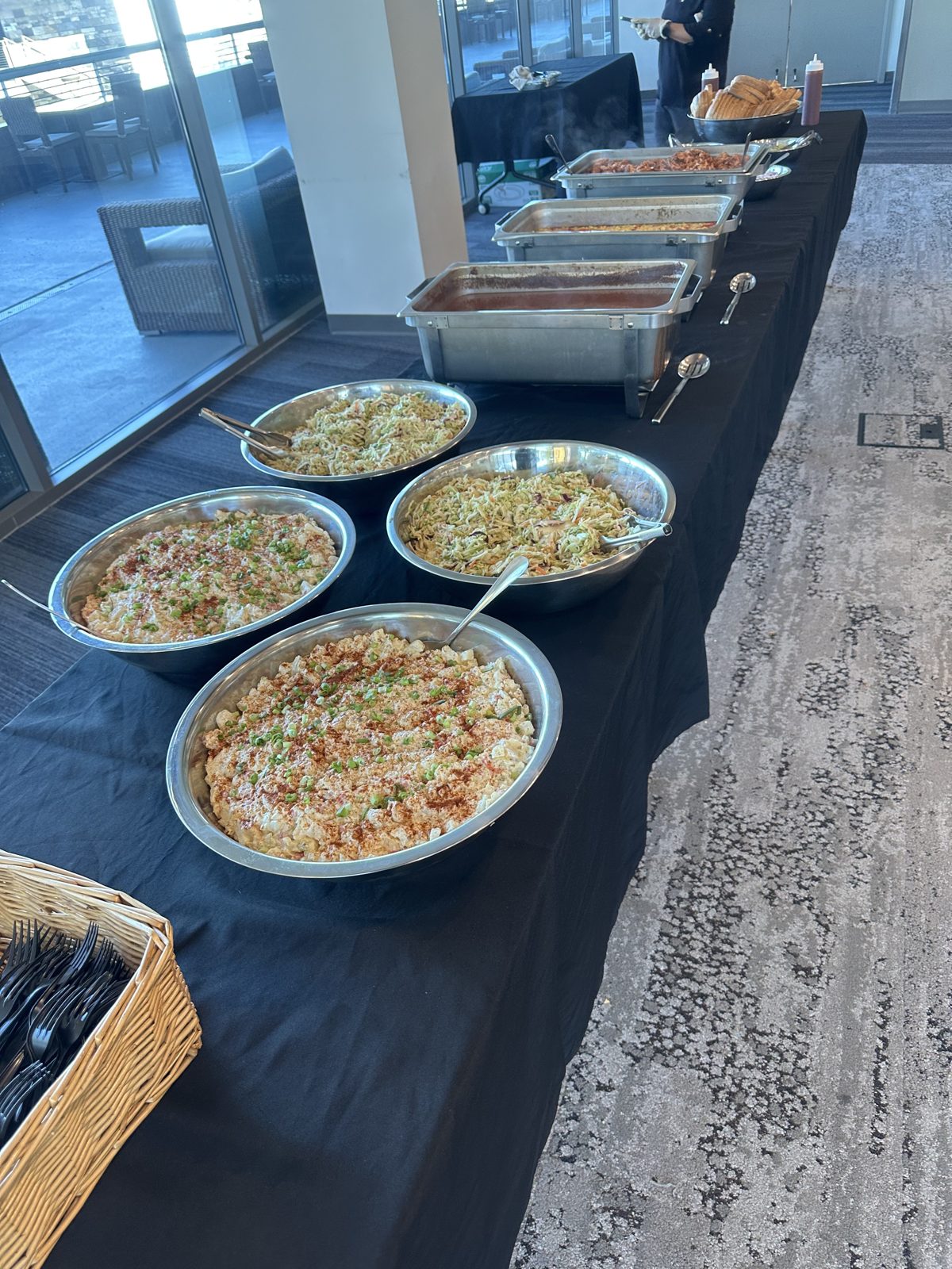 Barbecue buffet with potato salad, coleslaw and chafing dishes