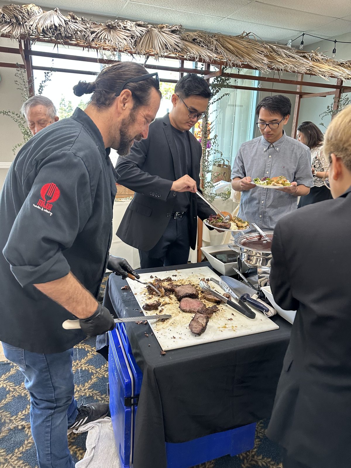 Major Events chef carving and serving guests at an event