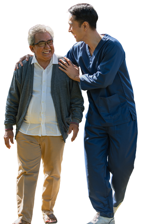 A smiling older man walking with a nurse in navy scrubs