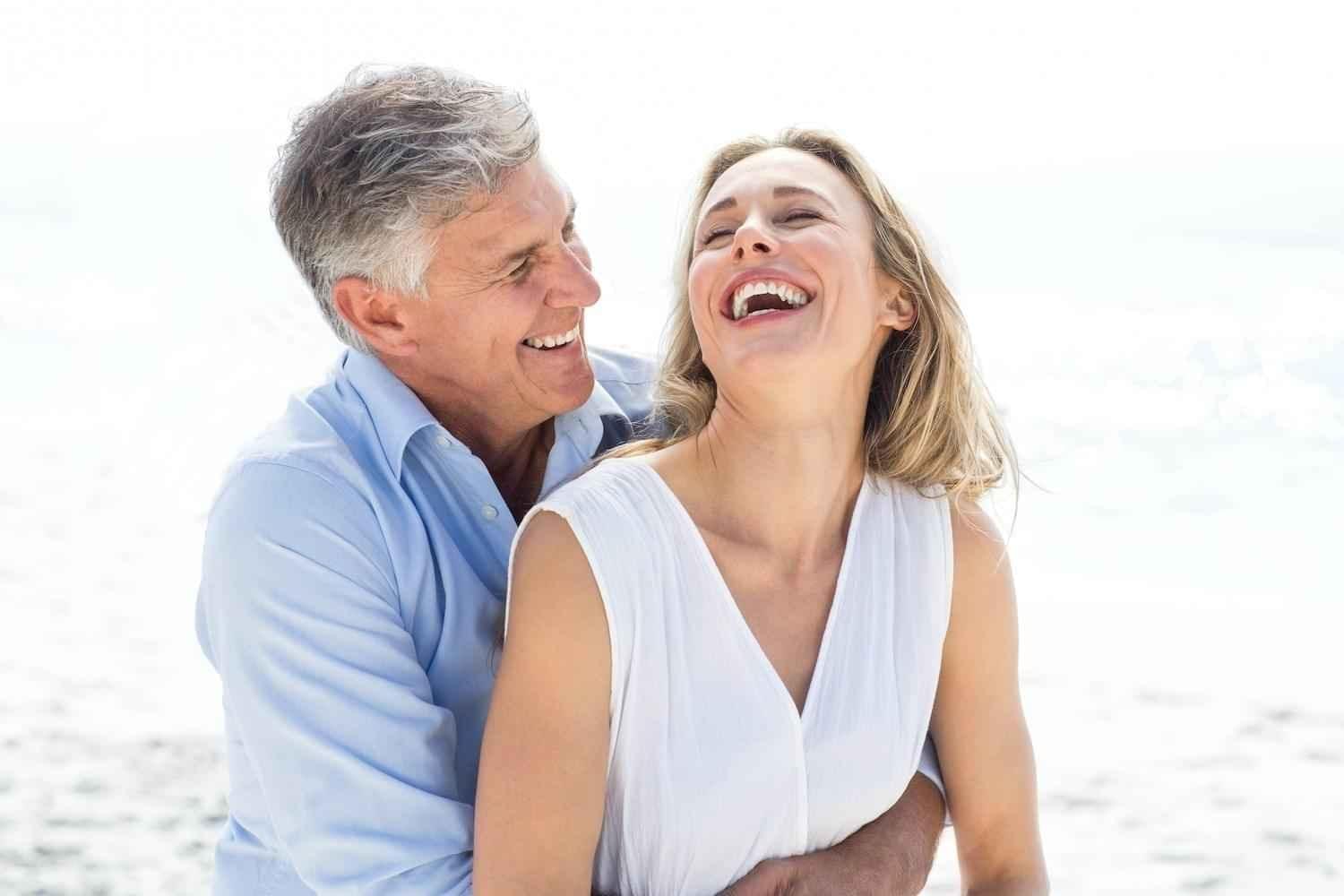 old-couple-enjoying-on-beach