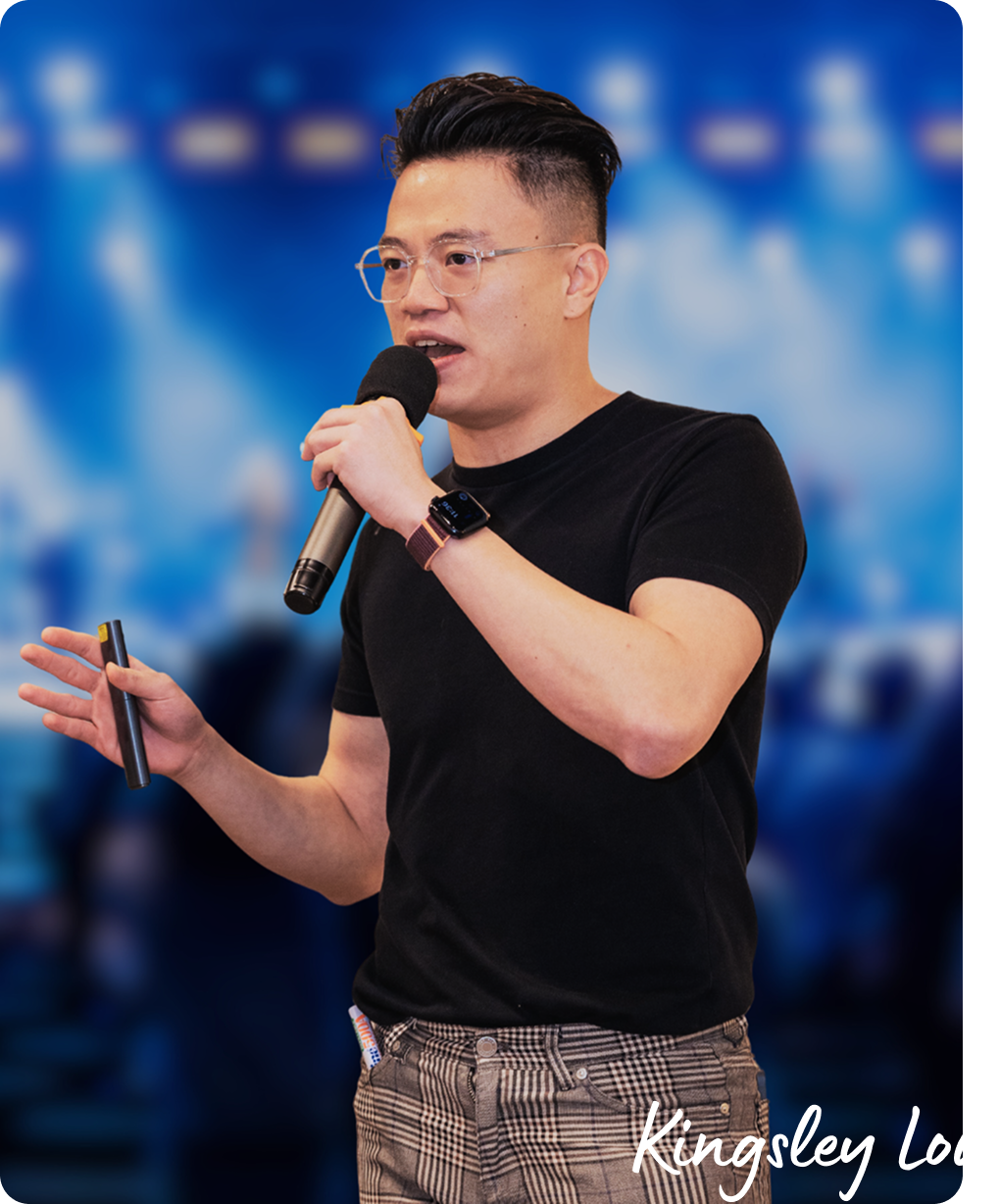 Kingsley Low is holding mic and speaking