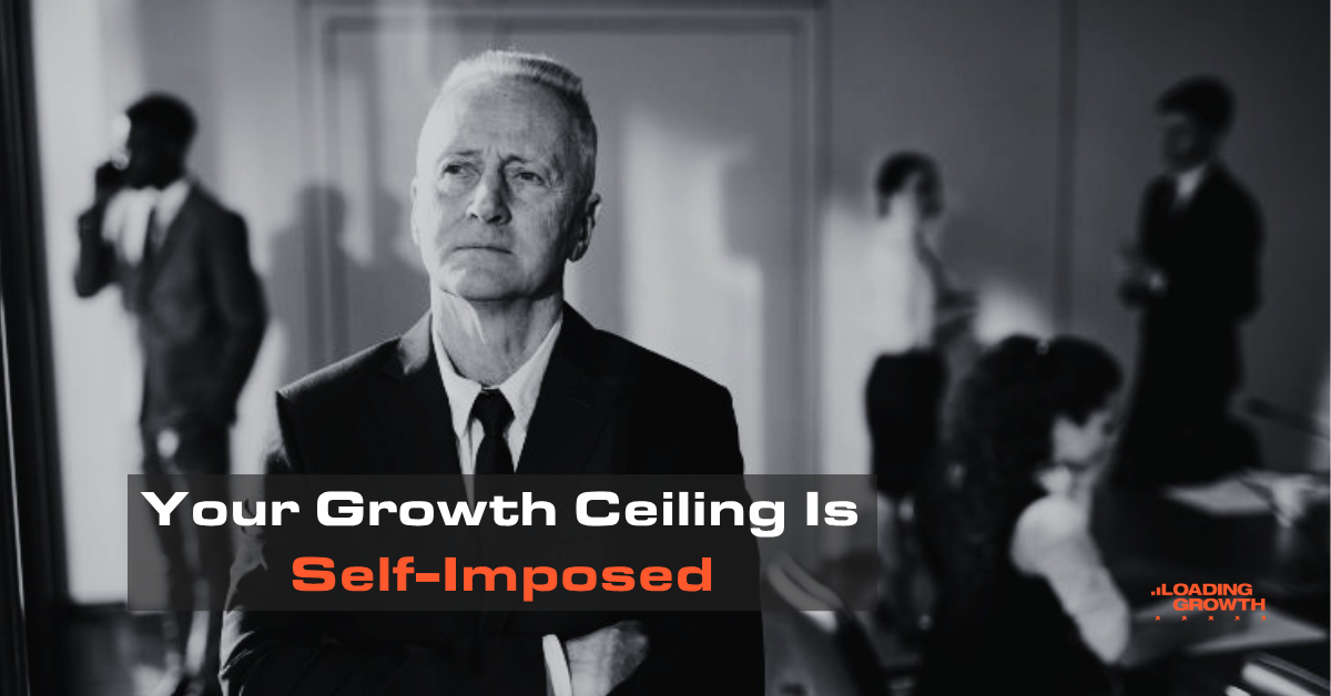 IT services business founder standing in office looking determined. IT services business growth ceiling.