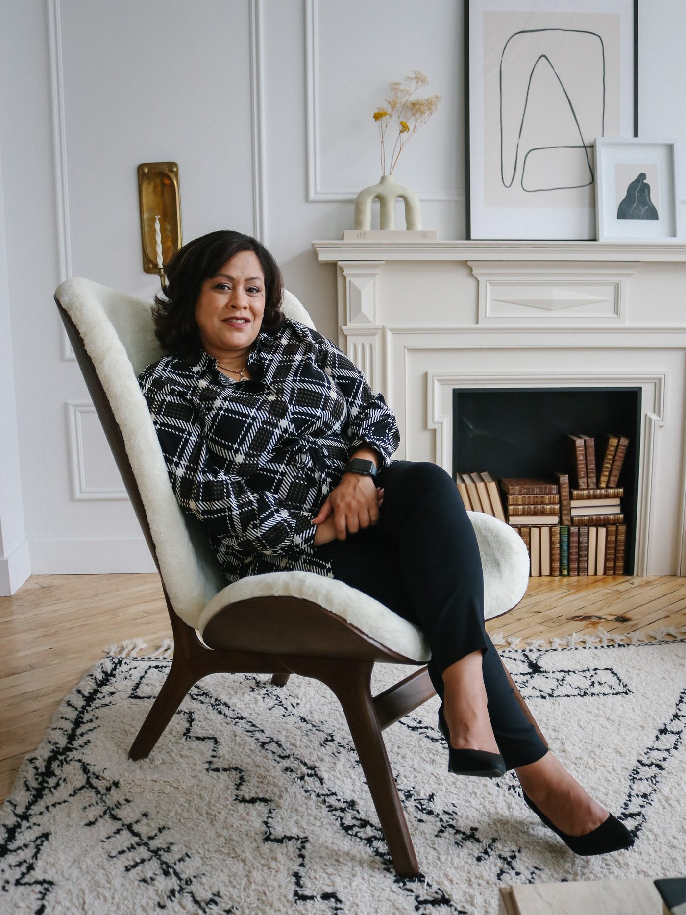 Christine Lambert seated in a bright, classic Toronto living room