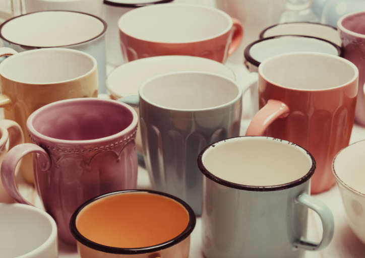 A stack of old coffee mugs is another reason why do I keep things I don’t need anymore