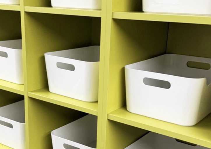 A wall of organizing bins