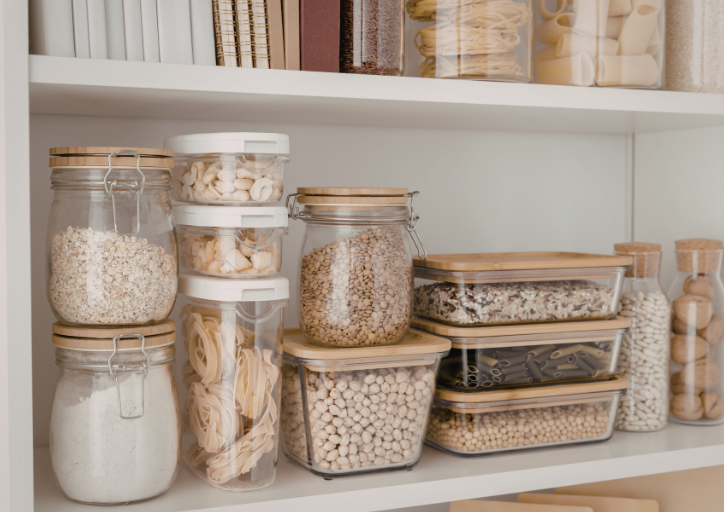 Jars and containers lined up in a kitchen pantry. Jars and containers lined up in a kitchen pantry.