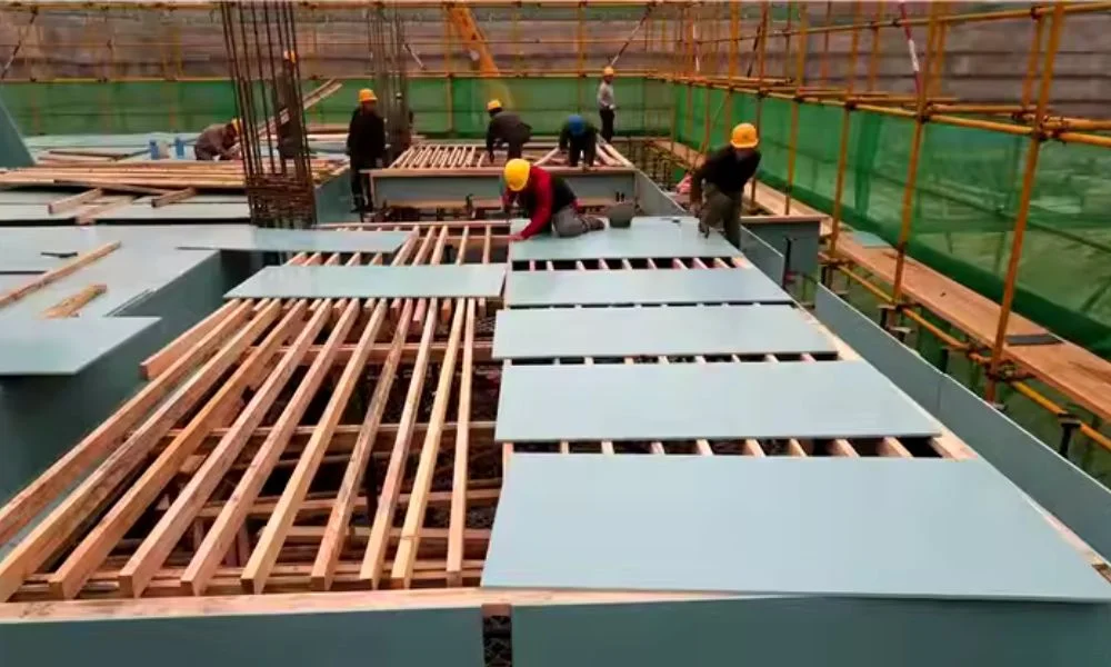 A construction worker performing safety checks on heavy-duty slab formwork to ensure quality and reliability