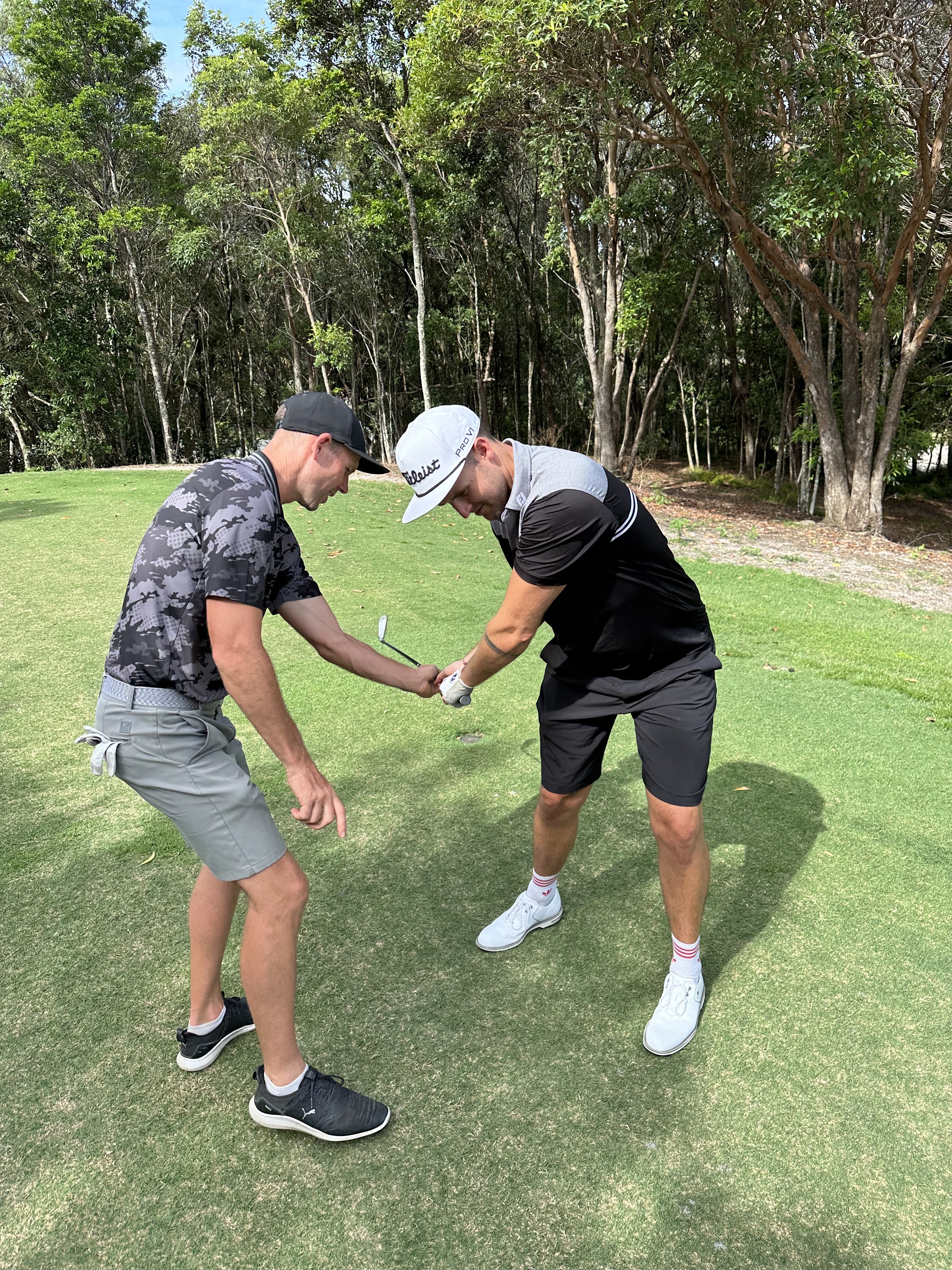 Wade Hooper demonstrating proper golf swing technique