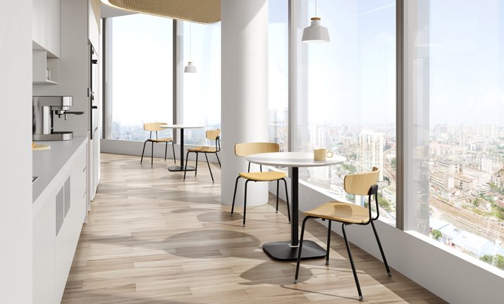 Sunon pantry café with round pedestal tables and wood-seat chairs by the windows