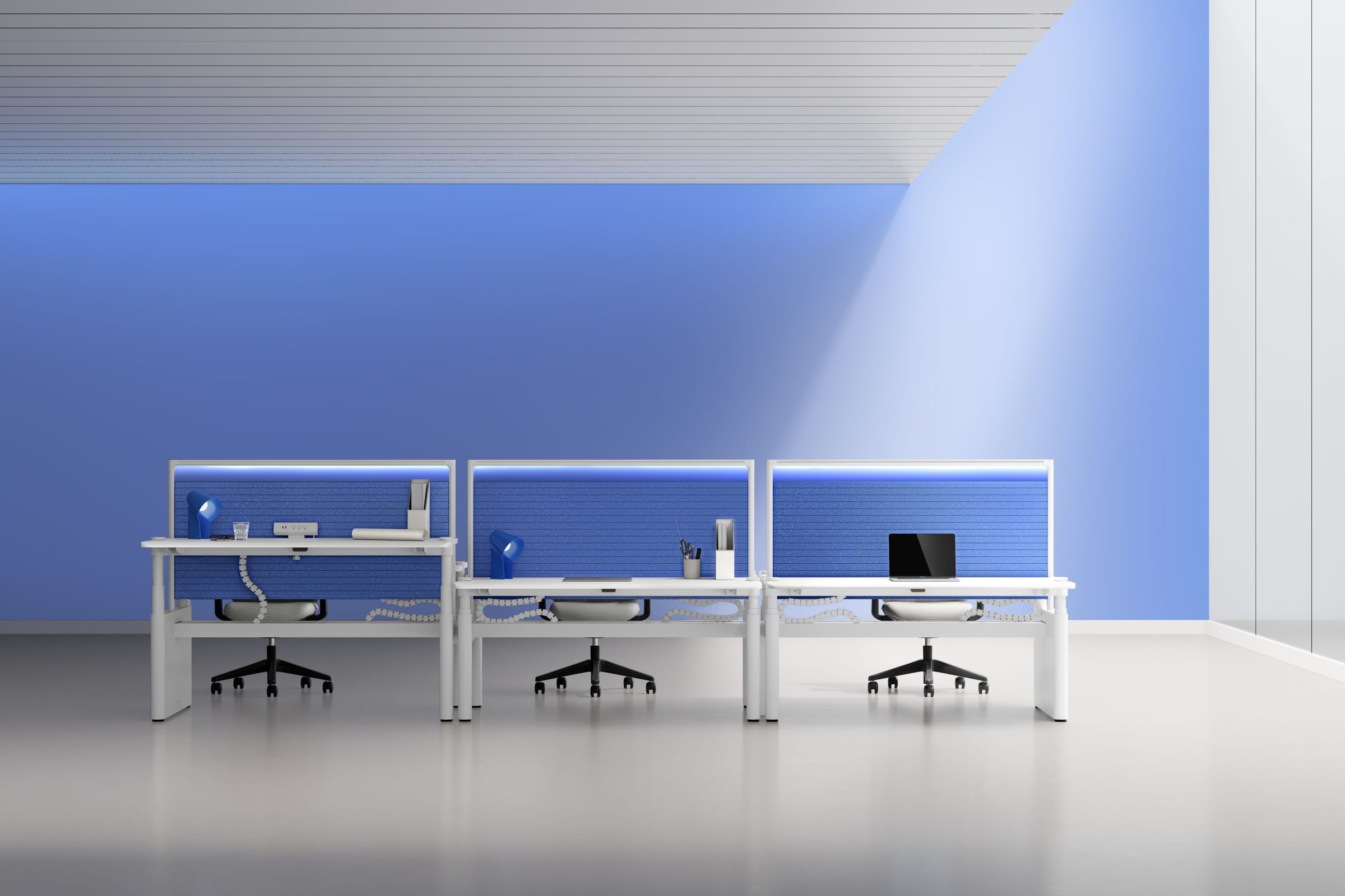 Sunon sit-stand row with lit blue acoustic screens