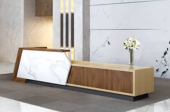 Sunon reception desk with white marble front panel, walnut and brass finishes