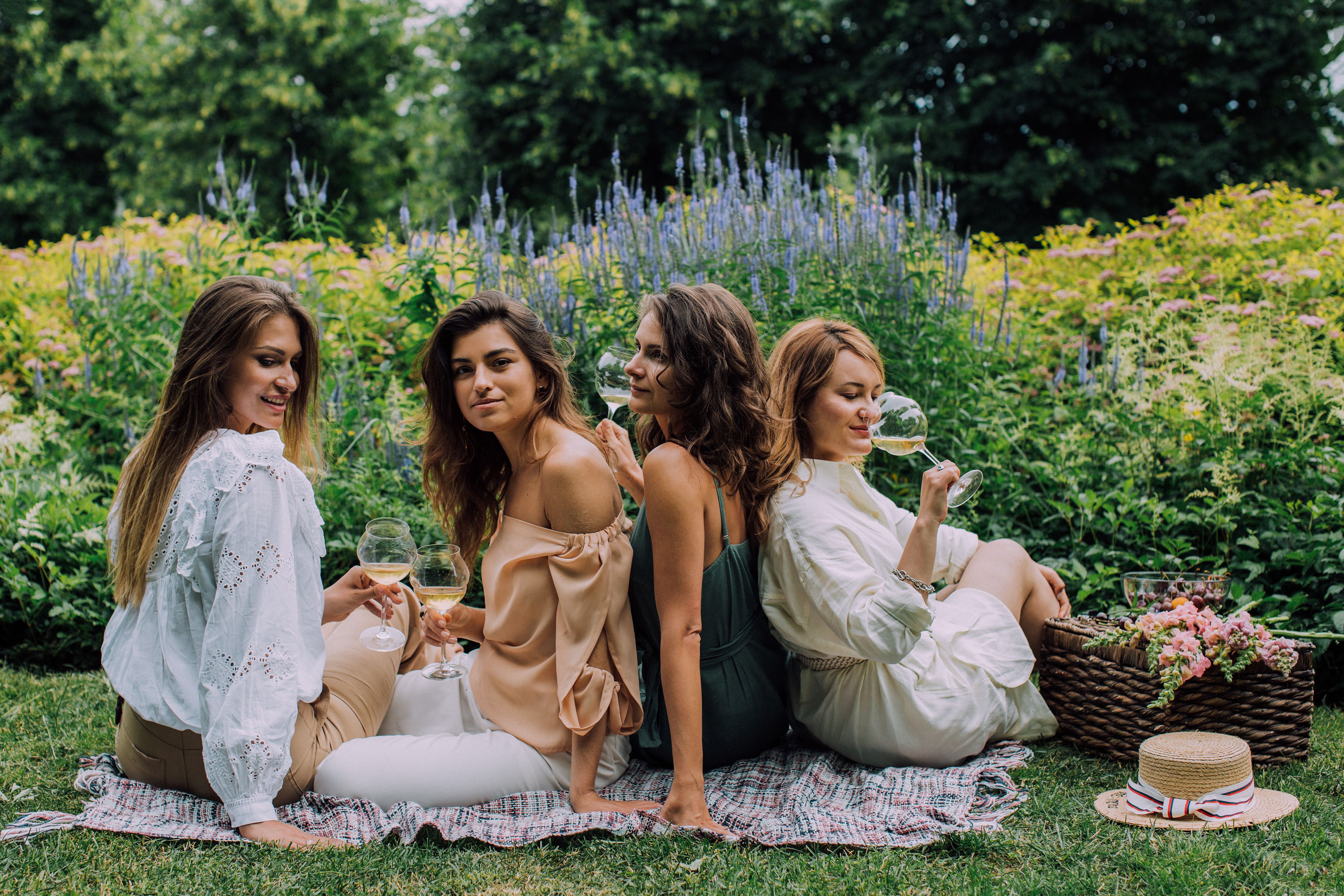 Women sharing wine at dusk on the Villamena terrace