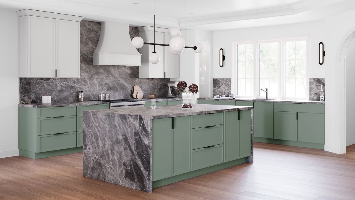 Kitchen with sage green shaker base cabinets, white upper cabinets and a grey marble waterfall island
