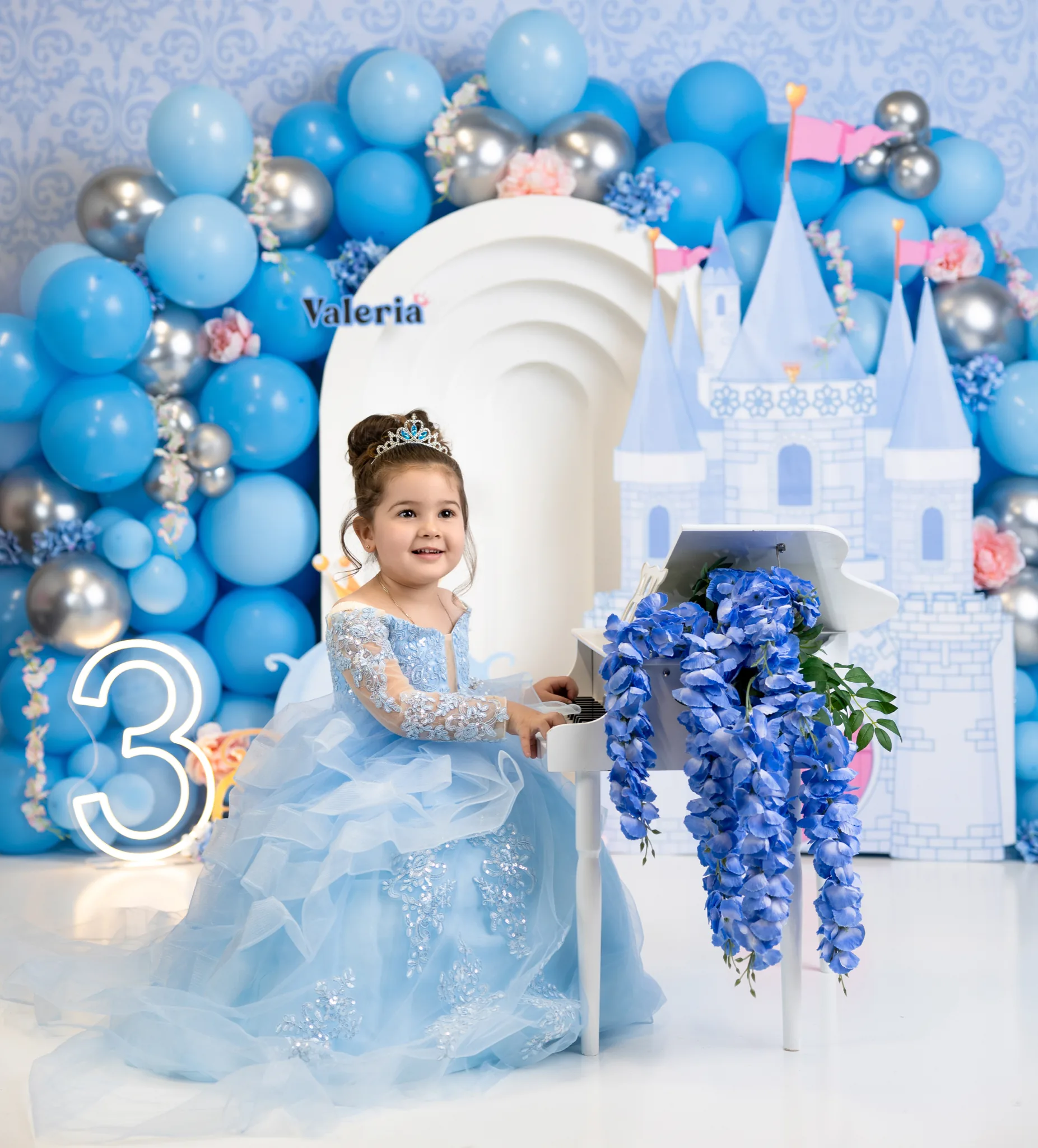 Child smiling in a festive holiday setting