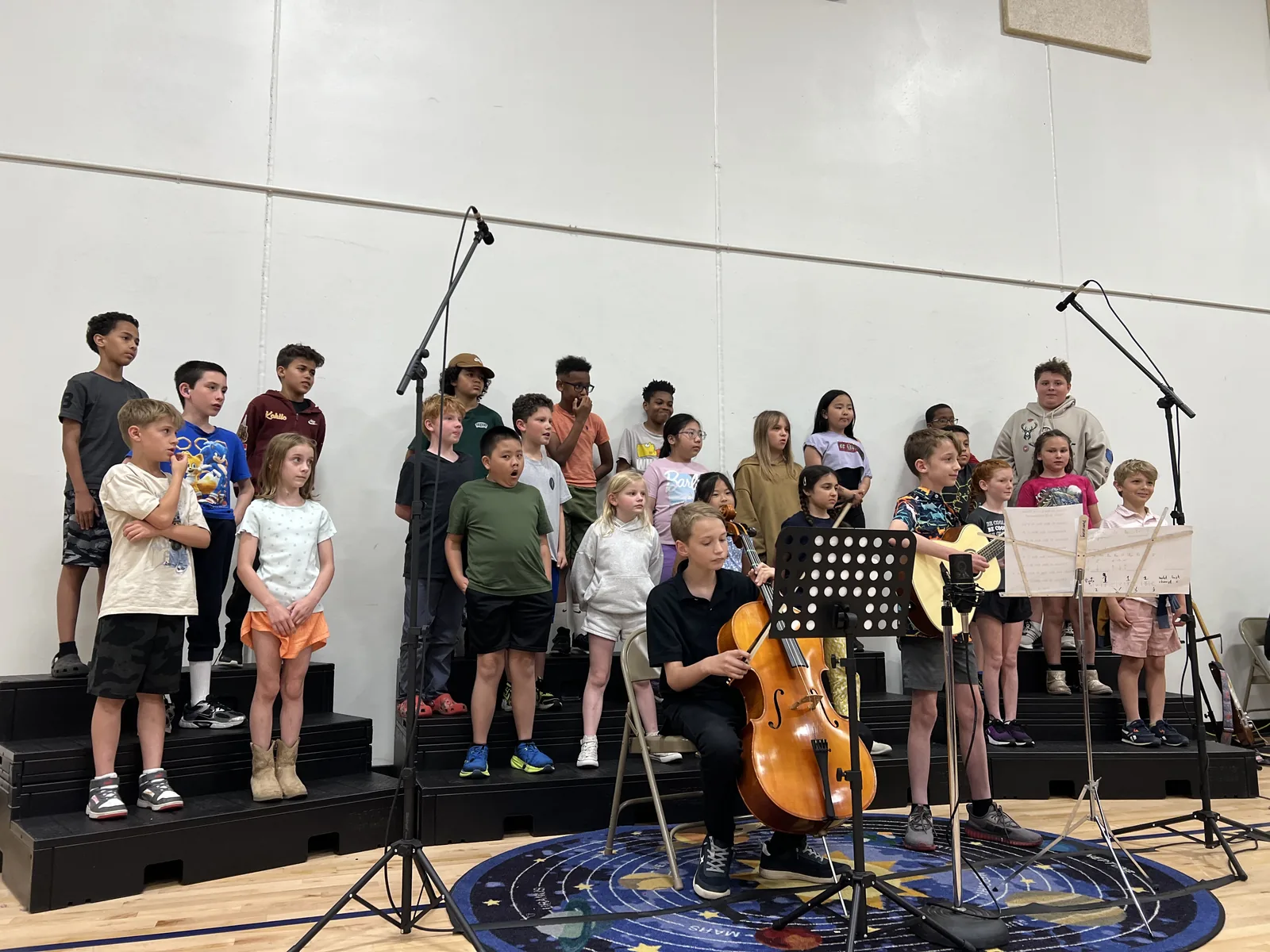 Students playing instruments together during a classroom music activity.
