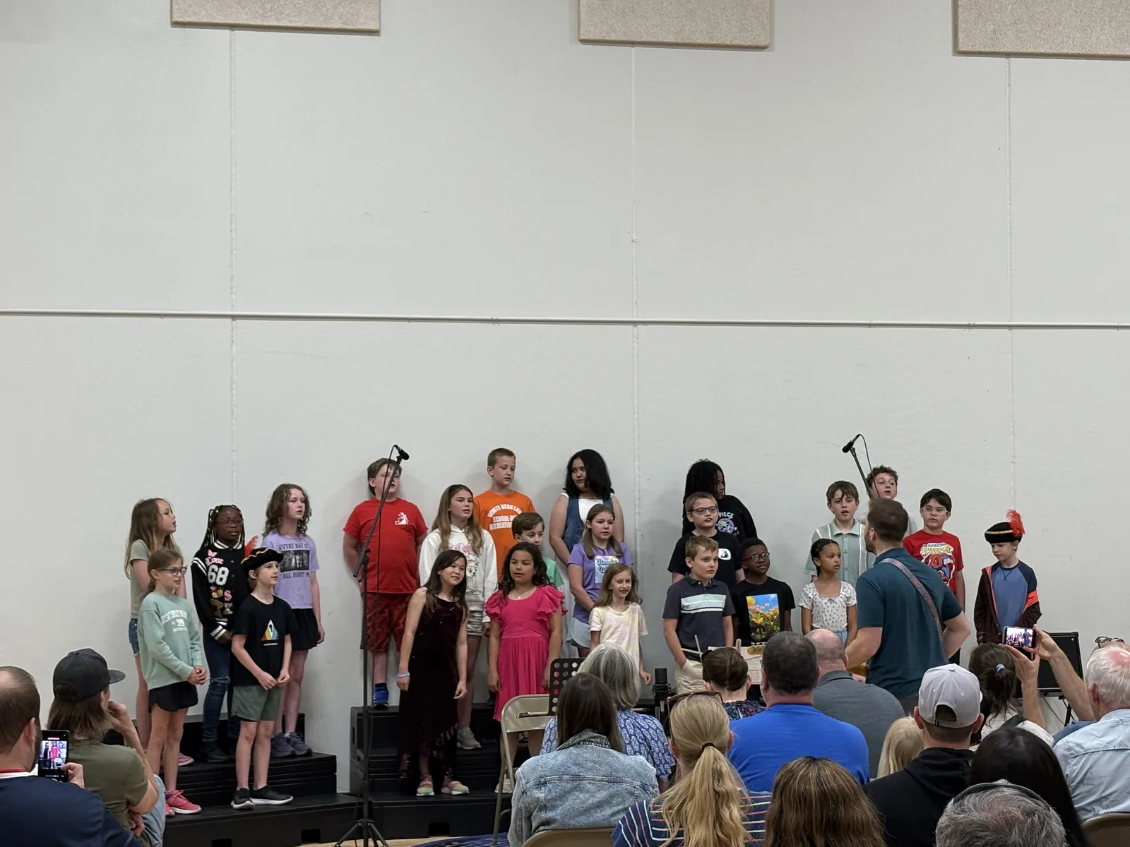 Students singing together during a school concert.