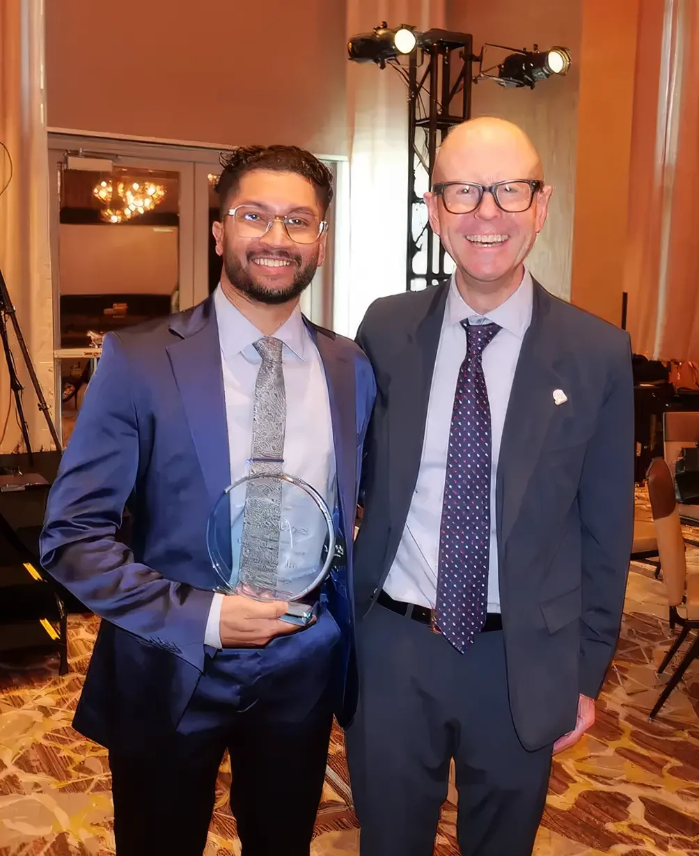 Abir Hossain, ALPS Ambassador and Temple University DPM/MBA candidate, holding an award at DFCON.