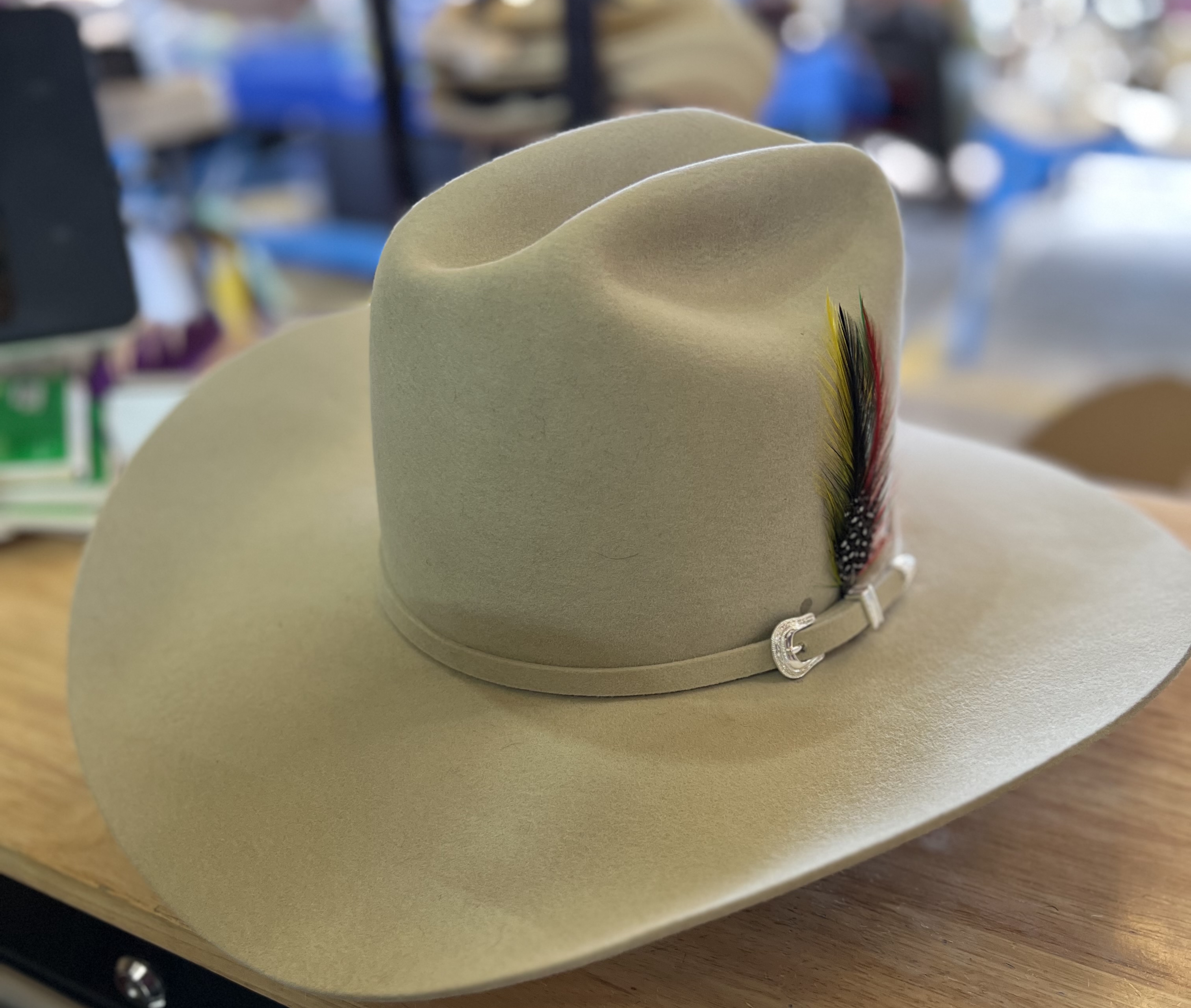 Custom cream cowboy hat with feather band