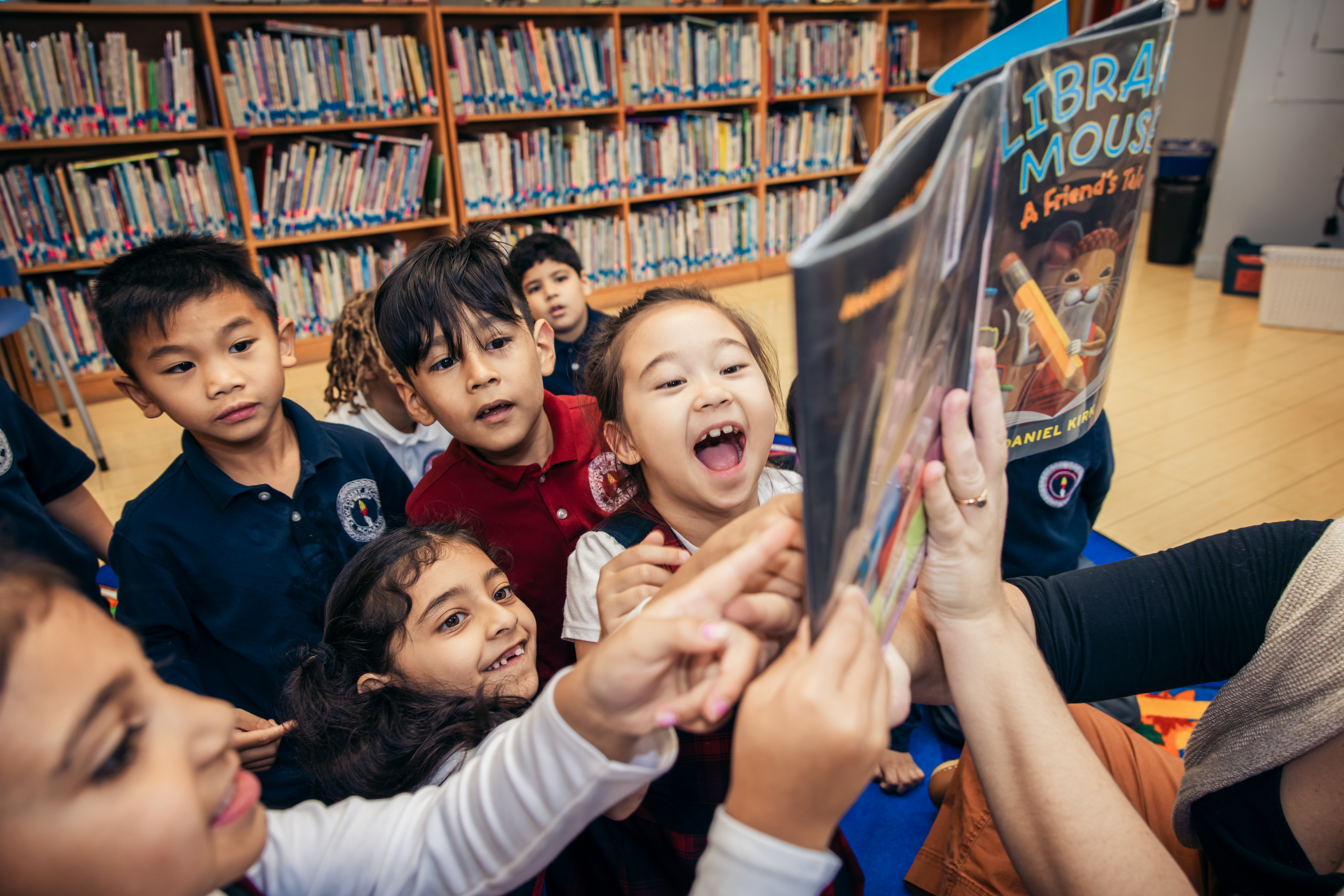 Young students enjoying reading together