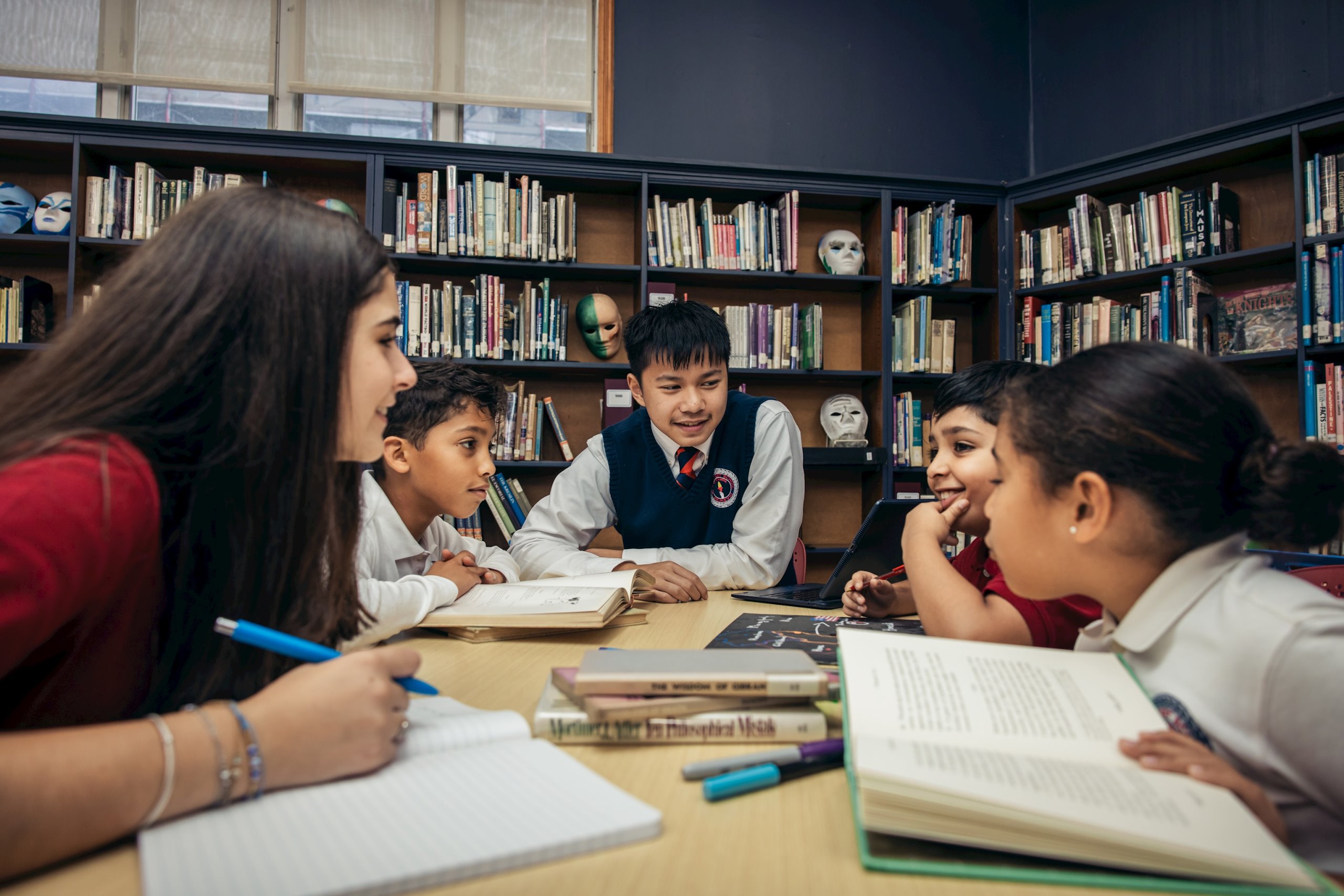 Kew-Forest students studying together in the library