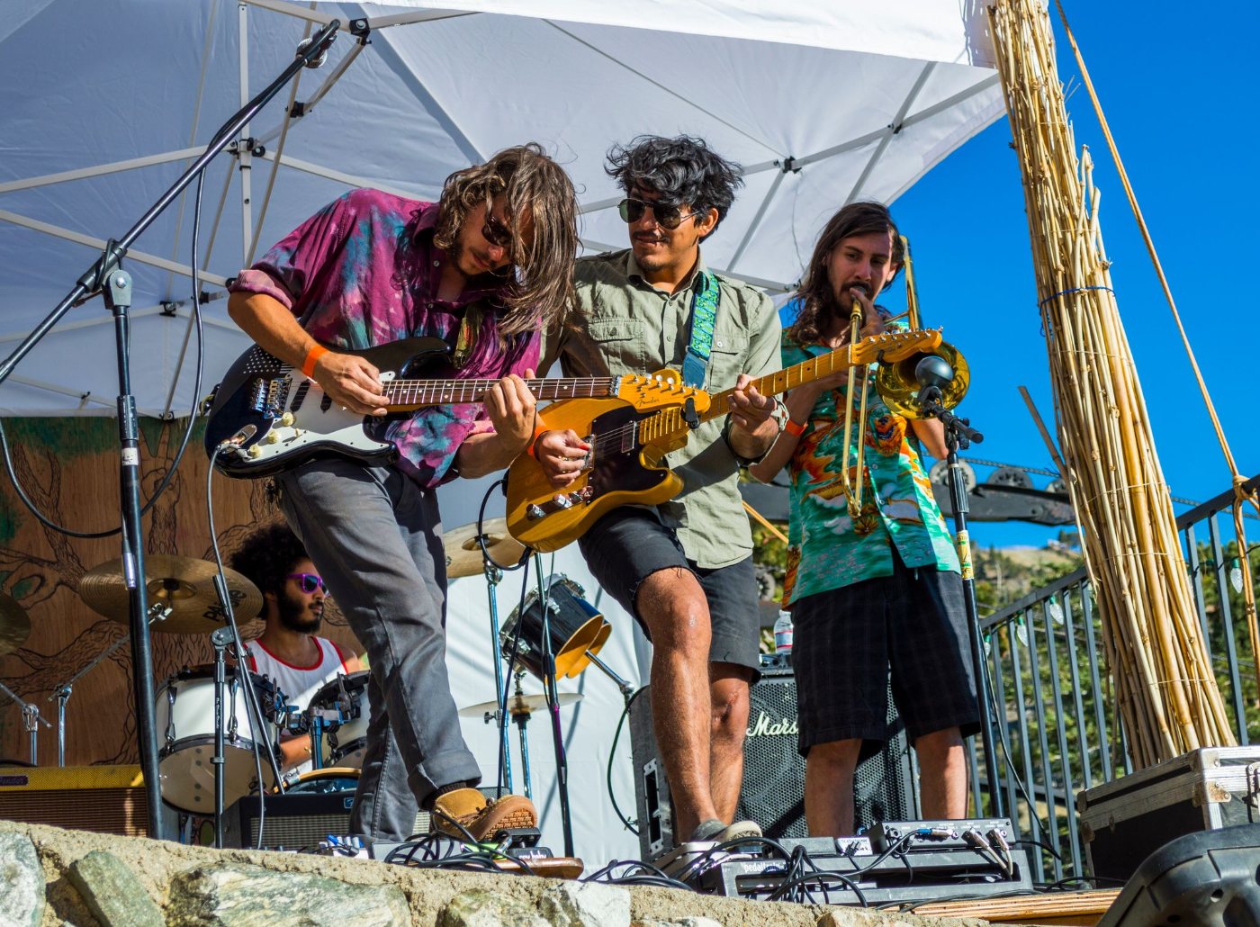 A band playing for a crowd at the Notch