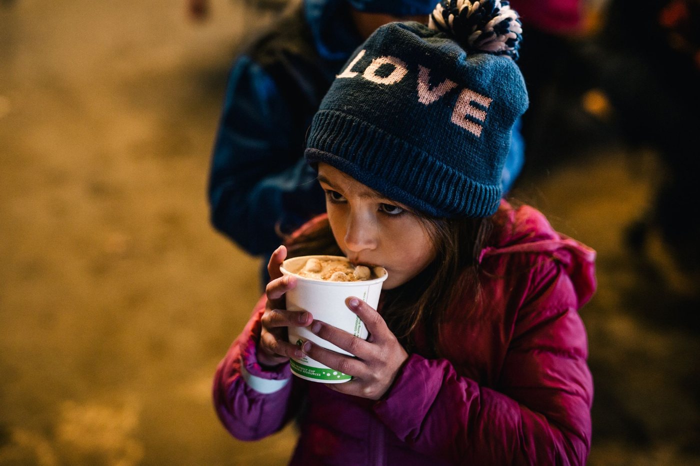 A girl sipping hot chocolate