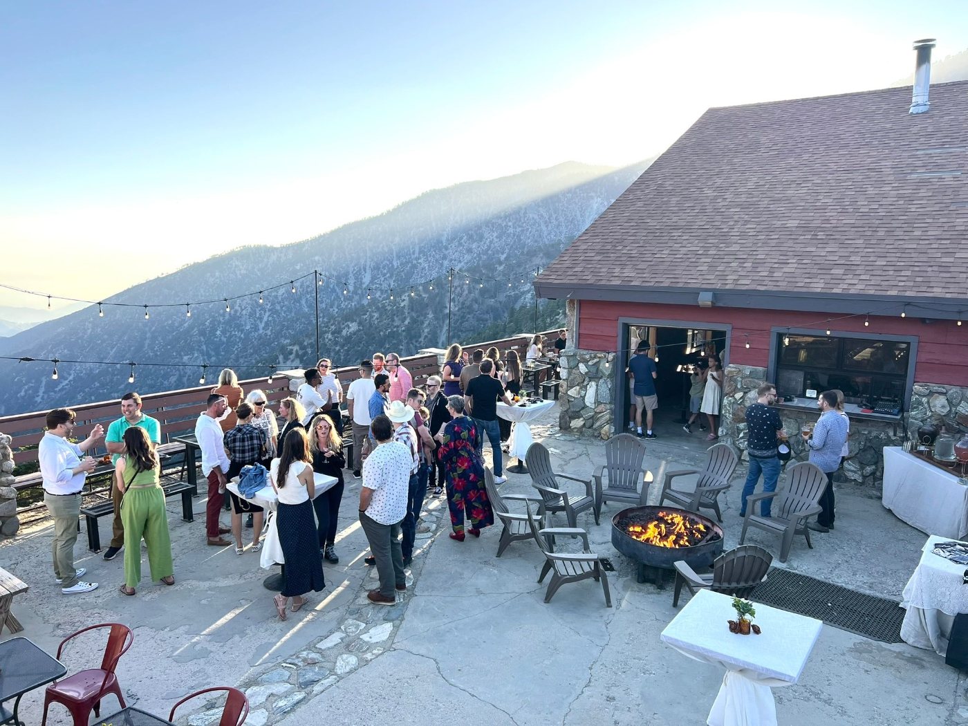Guests mingling at a party on the deck