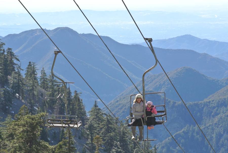 Riders on the Sugar Pine chairlift above the San Gabriel Mountains