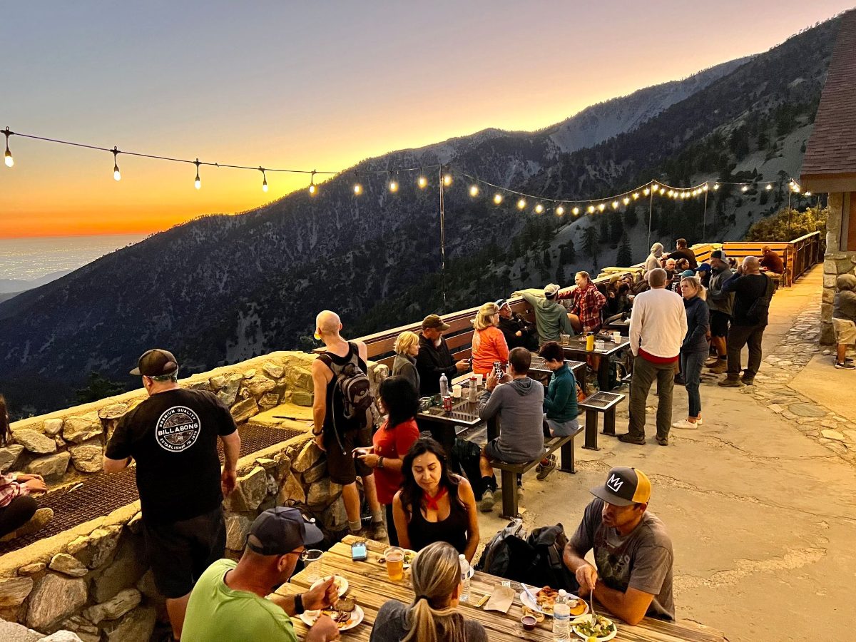 A crowd on the Top of the Notch deck at sunset