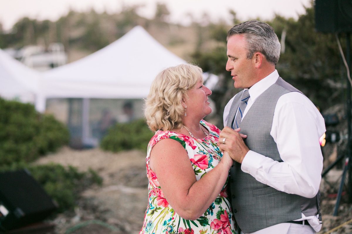 A couple dancing at an outdoor event on the mountain