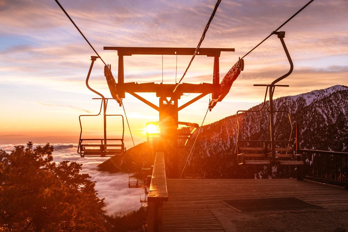 The chairlift silhouetted against a winter sunset